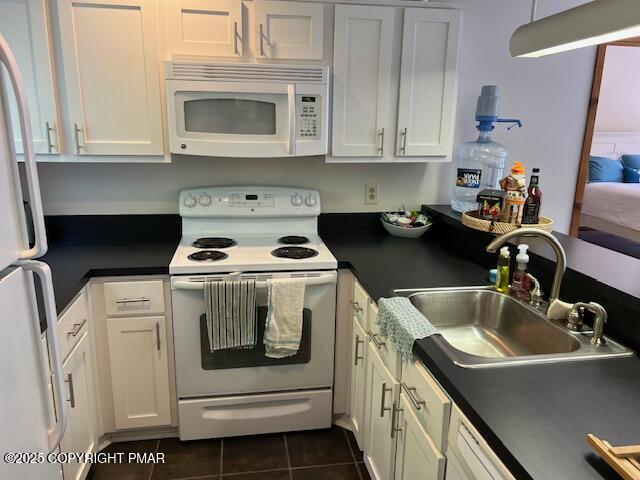 324 Hollow Road, Unit 325 East Stroudsburg, PA 18302 - Photo 7 of 17 a kitchen with a stove sink and cabinets