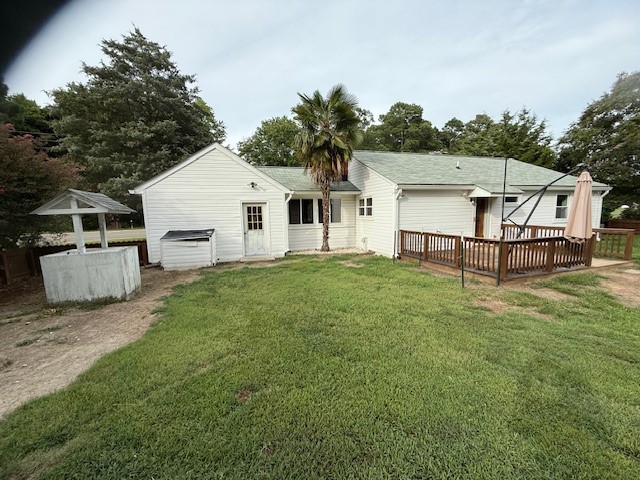 562 Timberneck Road Deltaville, VA 23043 - Photo 6 of 8 Rear view of house featuring a fenced rear yard and a deck