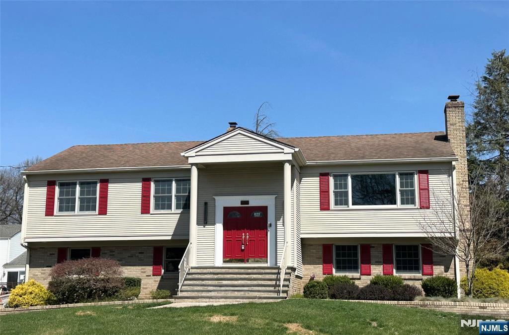 850 Ridgewood Avenue Oradell, NJ 07649 - Photo 1 of 48 a front view of a house with garden