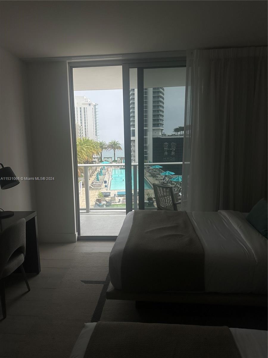 4010 South Ocean Drive, Unit R707 Hollywood, FL 33019 - Photo 11 of 70 a bedroom with a bed and a window