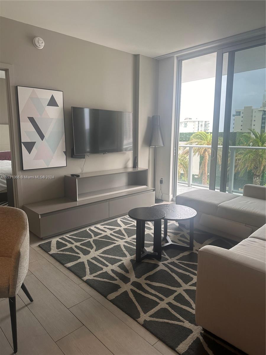 4010 South Ocean Drive, Unit R707 Hollywood, FL 33019 - Photo 14 of 70 a living room with a couch and a table