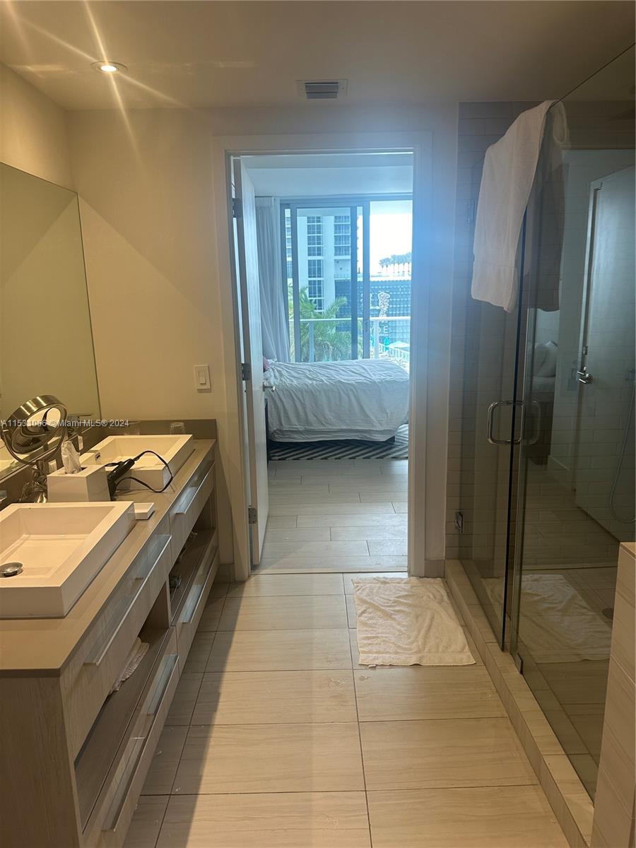 4010 South Ocean Drive, Unit R707 Hollywood, FL 33019 - Photo 23 of 70 a bathroom with a sink a toilet and a shower