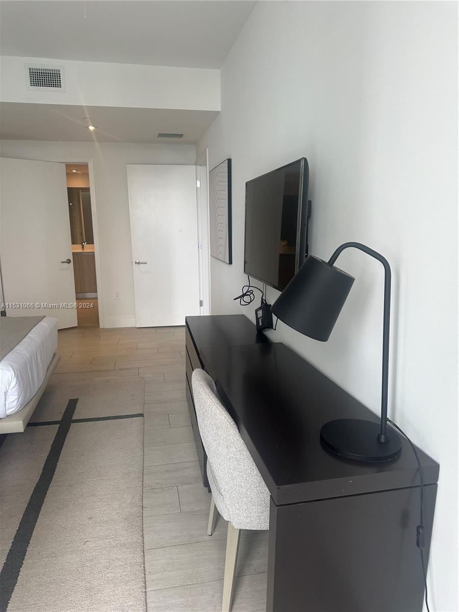 4010 South Ocean Drive, Unit R707 Hollywood, FL 33019 - Photo 25 of 70 a room with a couch and a flat screen tv