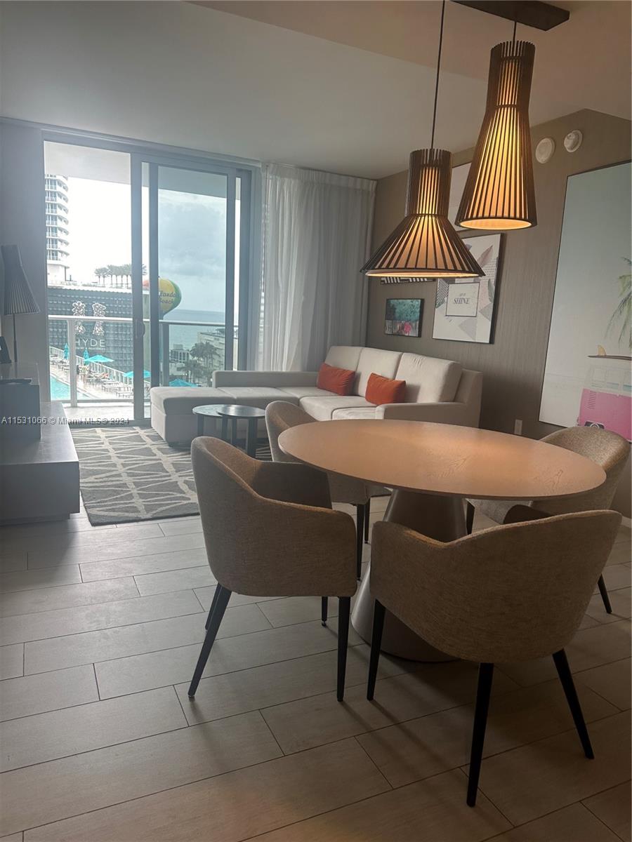 4010 South Ocean Drive, Unit R707 Hollywood, FL 33019 - Photo 31 of 70 a dining room with furniture and window