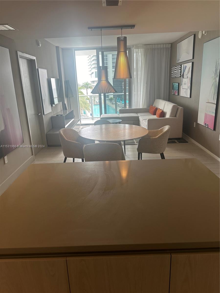 4010 South Ocean Drive, Unit R707 Hollywood, FL 33019 - Photo 33 of 70 a living room with furniture and a large window