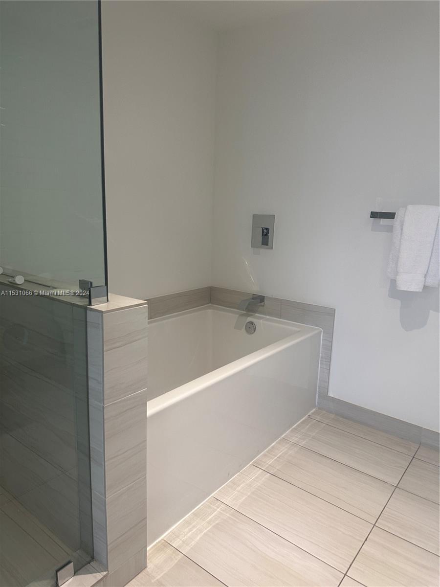 4010 South Ocean Drive, Unit R707 Hollywood, FL 33019 - Photo 36 of 70 a view of a bathtub in a bathroom