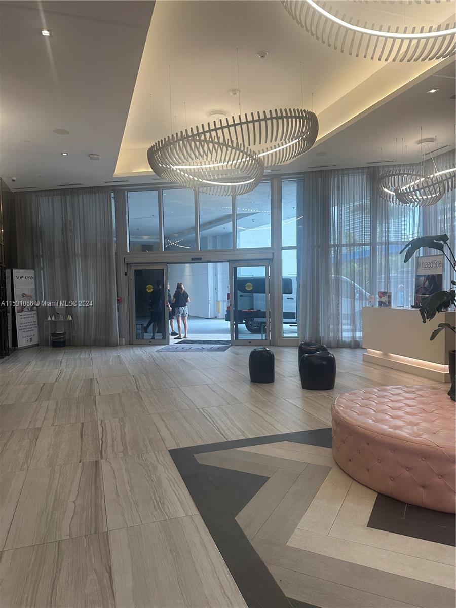 4010 South Ocean Drive, Unit R707 Hollywood, FL 33019 - Photo 4 of 70 a living room with furniture and a fireplace