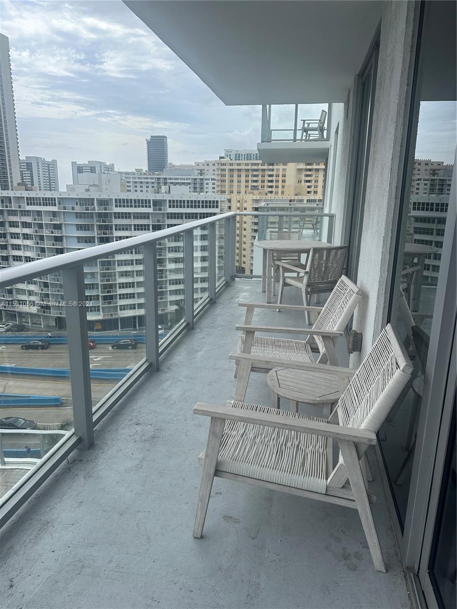4010 South Ocean Drive, Unit R707 Hollywood, FL 33019 - Photo 43 of 70 a view of a chairs and table in the balcony