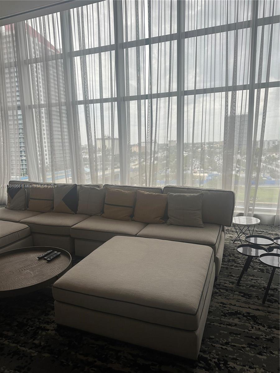 4010 South Ocean Drive, Unit R707 Hollywood, FL 33019 - Photo 63 of 70 a living room with furniture and a large window