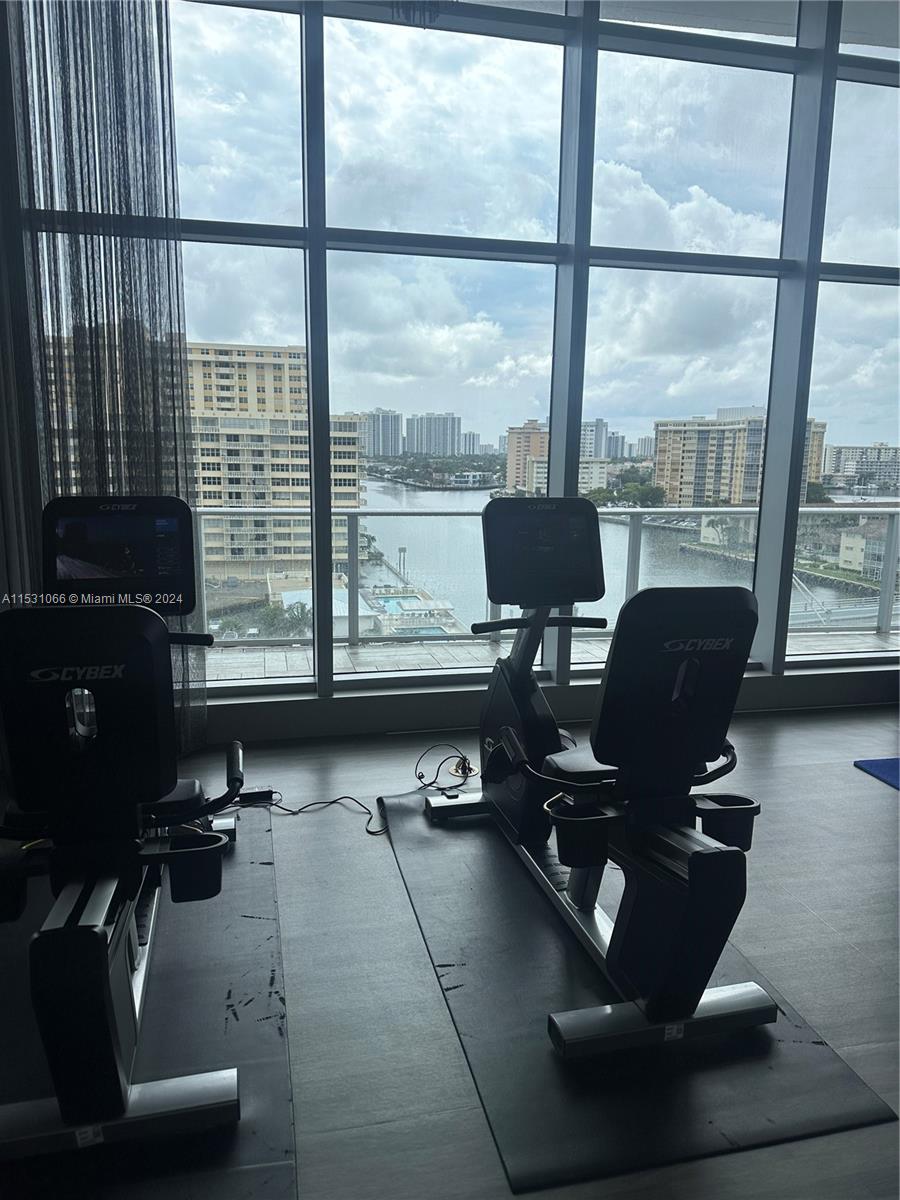 4010 South Ocean Drive, Unit R707 Hollywood, FL 33019 - Photo 69 of 70 a room with gym equipment and a large window