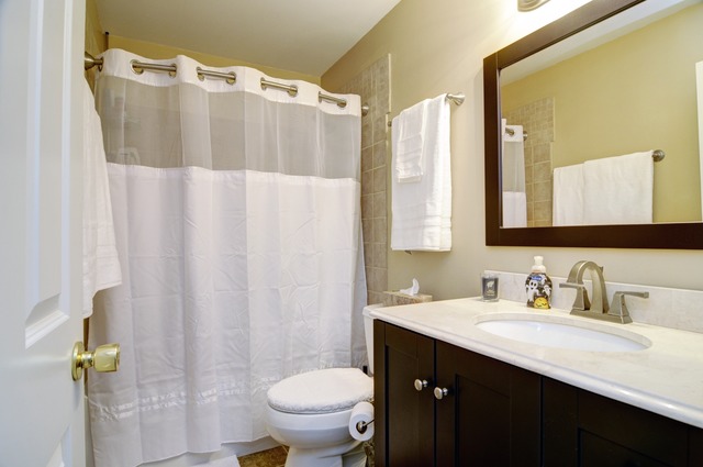 565 Springbrook Trail North Oswego, IL 60543 - Photo 14 of 21 a bathroom with a sink and a mirror