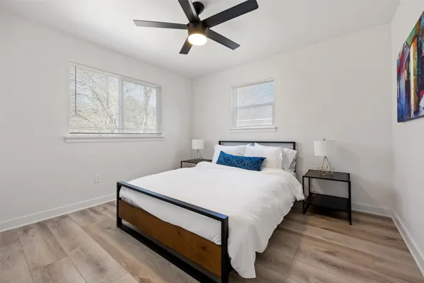 a bed room with a bed and a window