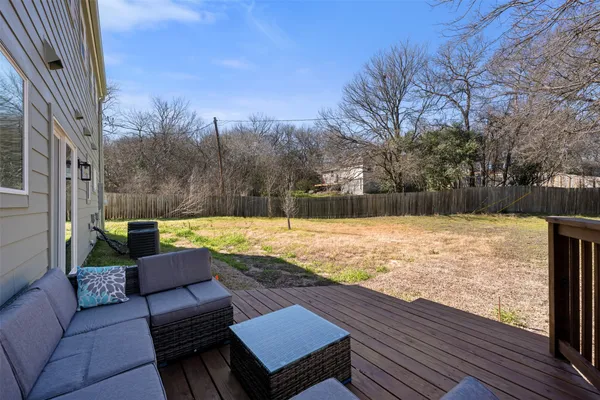 a view of a patio with a yard