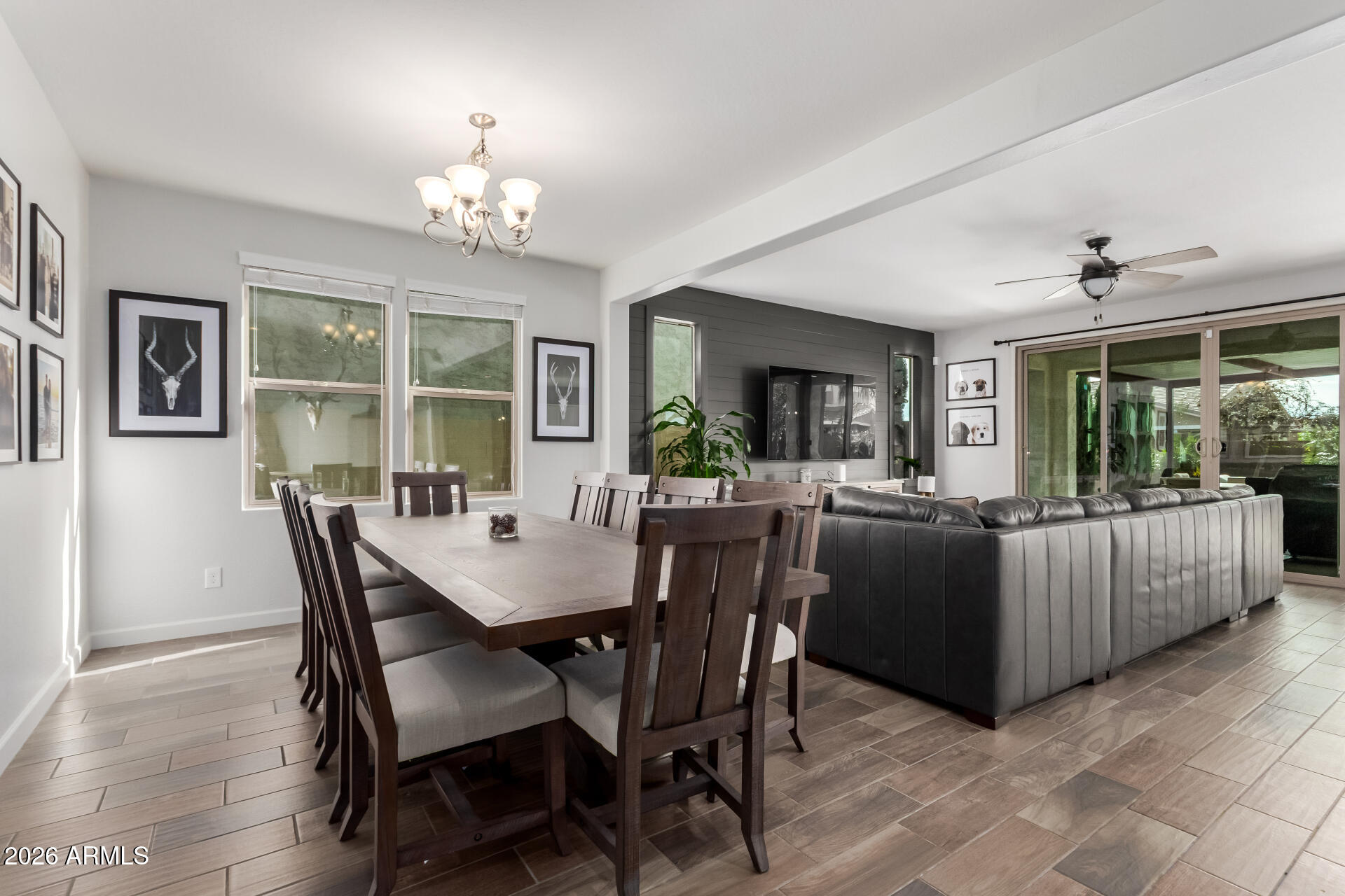 22083 East Camacho Road Queen Creek, AZ 85142 - Photo 9 of 42 a view of a dining room with furniture and chandelier