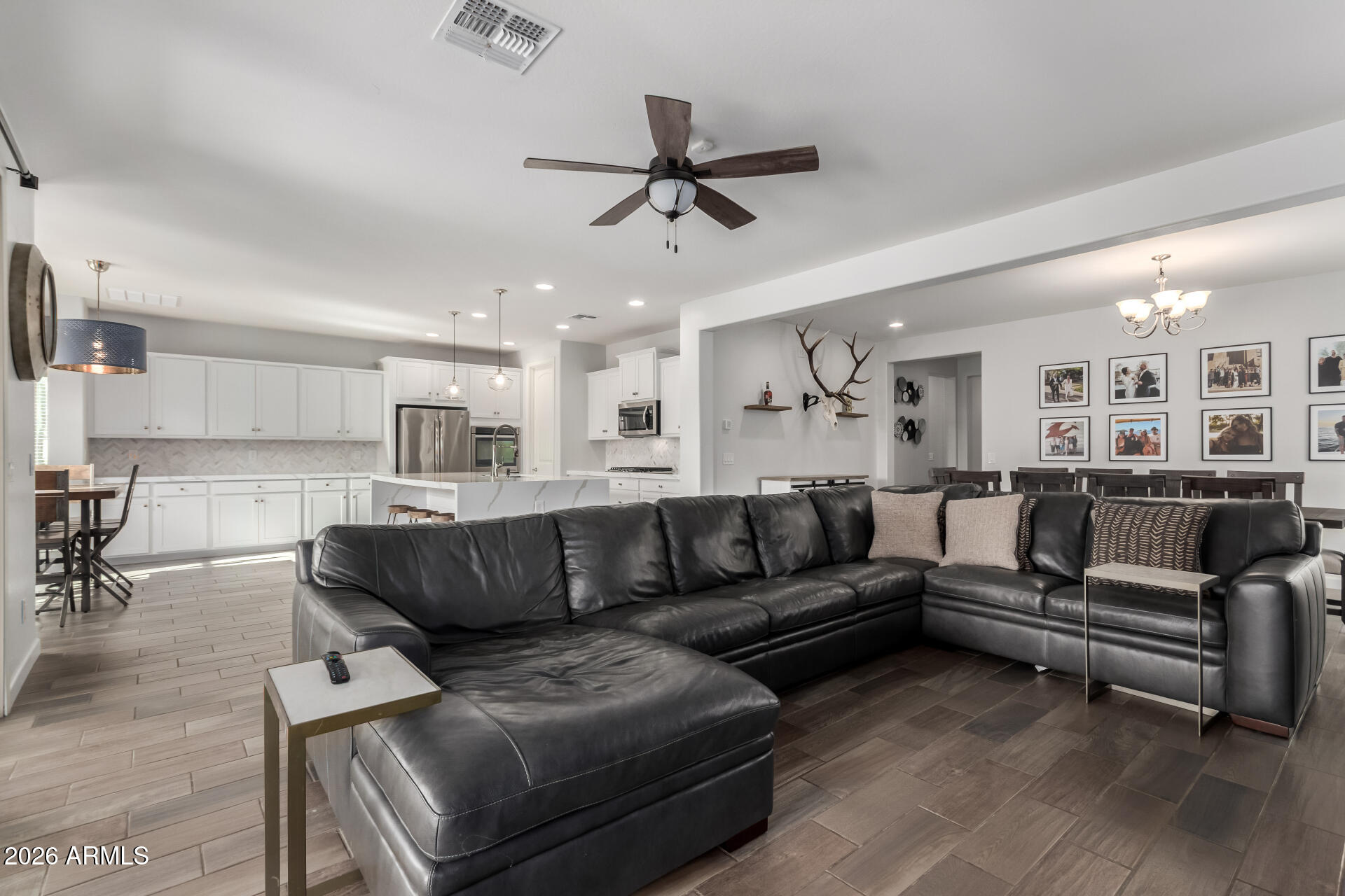 22083 East Camacho Road Queen Creek, AZ 85142 - Photo 12 of 42 a living room with furniture and kitchen view