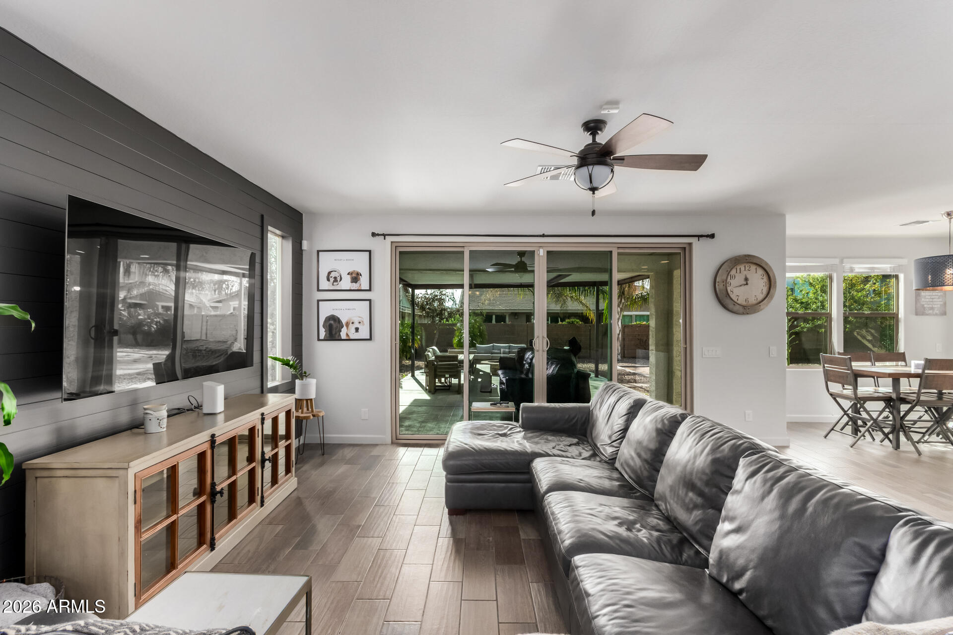 22083 East Camacho Road Queen Creek, AZ 85142 - Photo 13 of 42 a living room with furniture ceiling fan and a large window