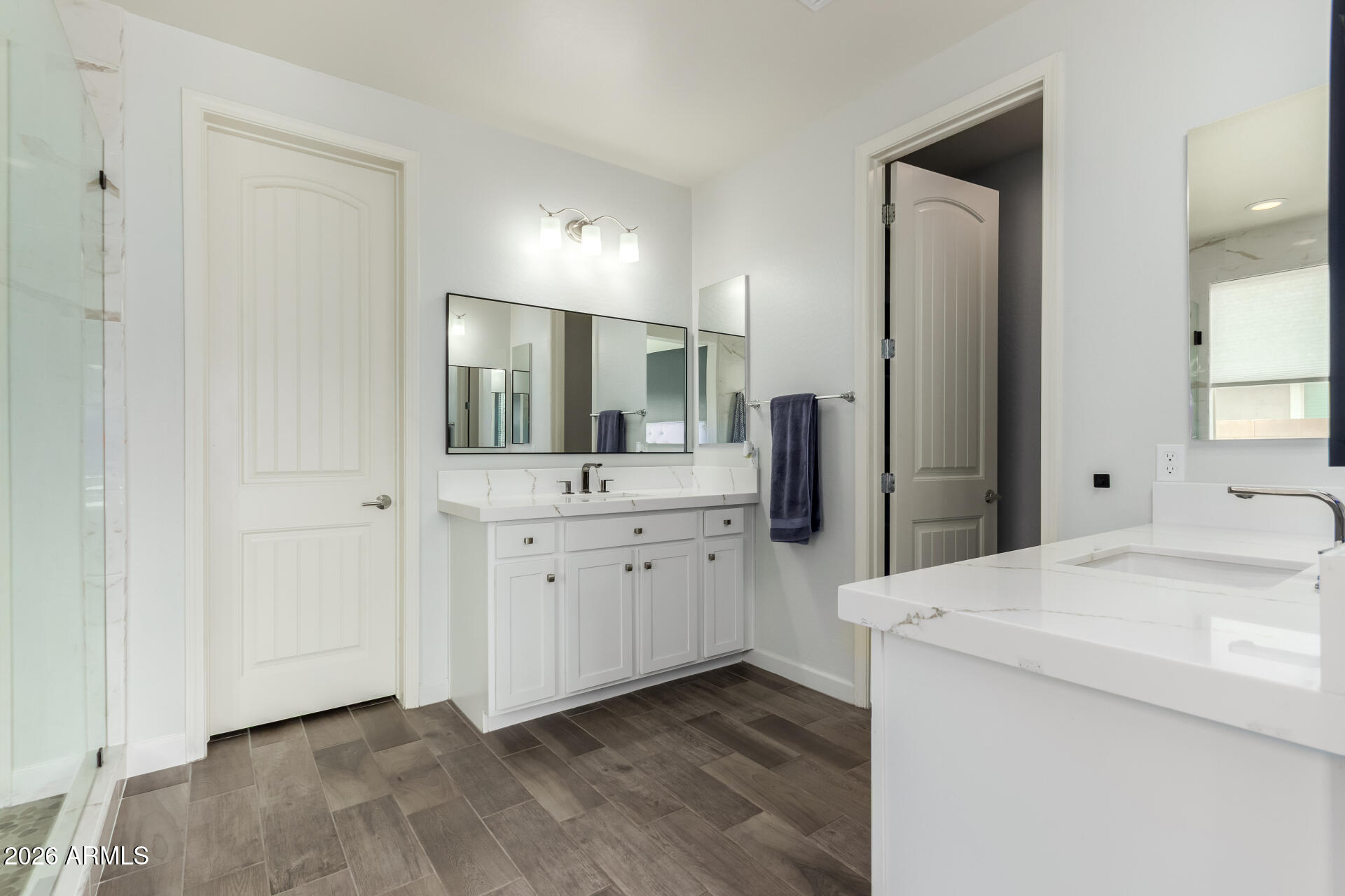 22083 East Camacho Road Queen Creek, AZ 85142 - Photo 23 of 42 a bathroom with a sink and a mirror