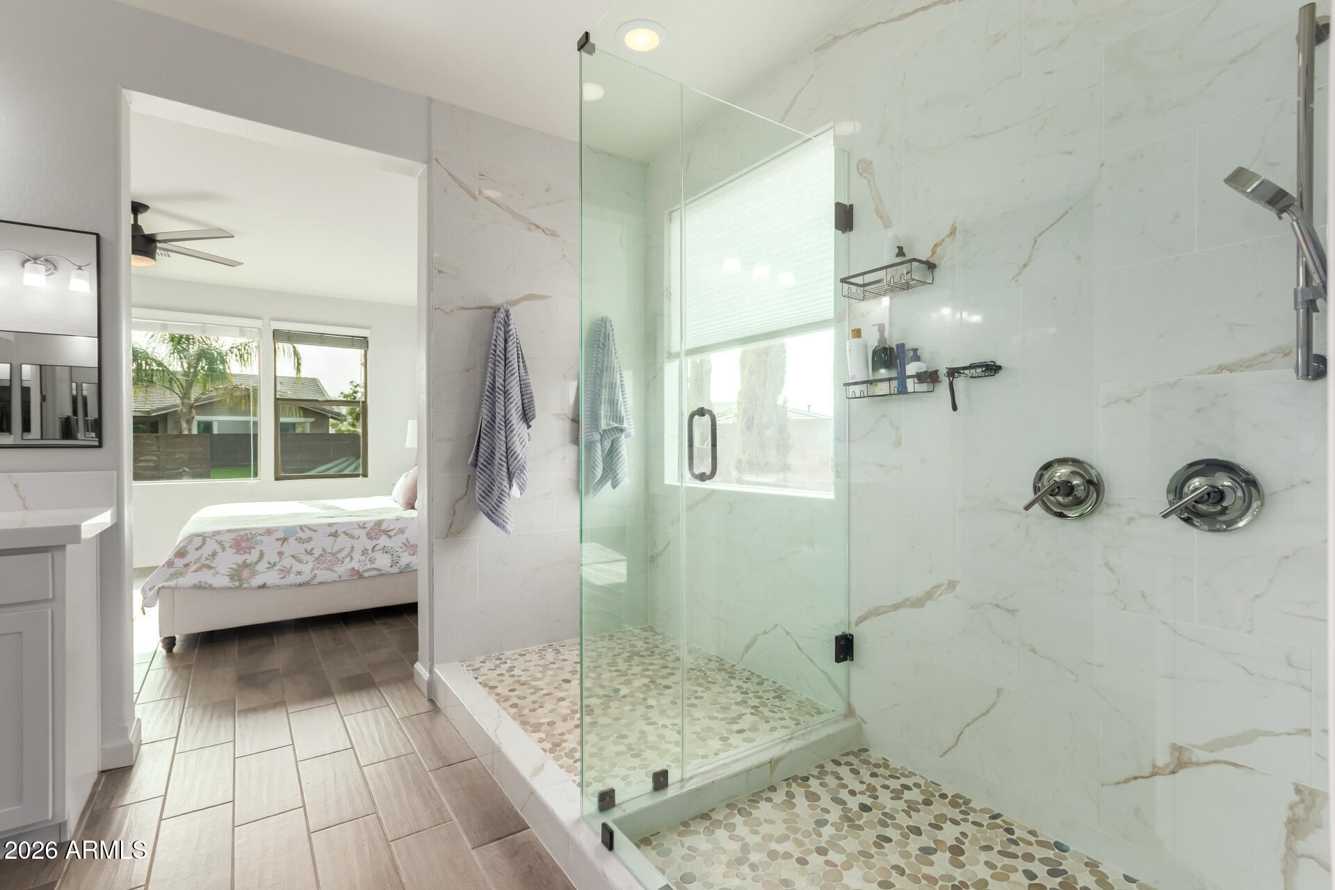 22083 East Camacho Road Queen Creek, AZ 85142 - Photo 24 of 42 a bathroom with a tub shower and sink
