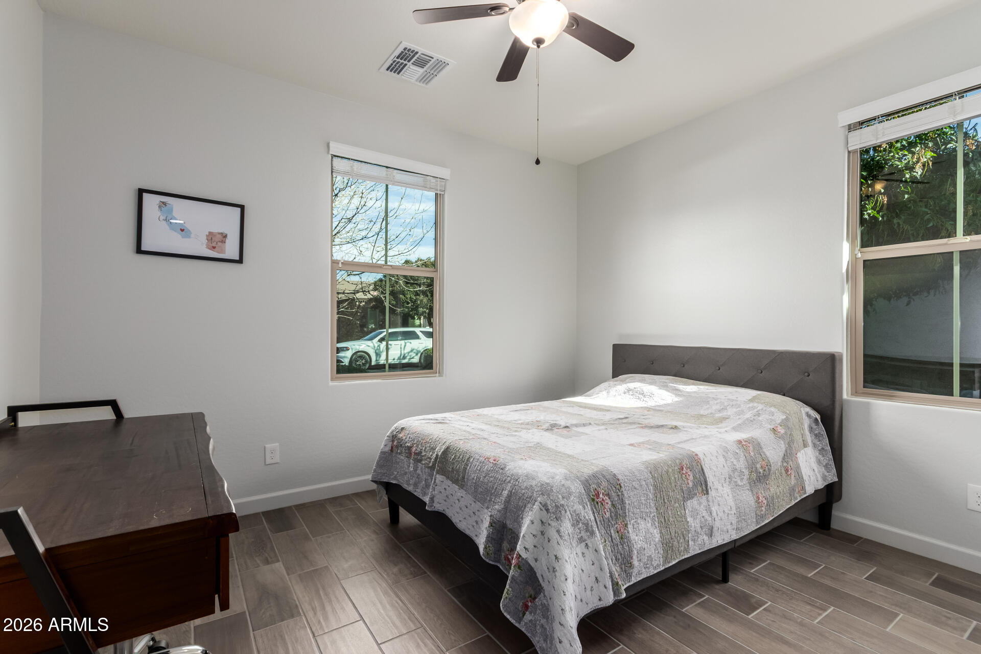 22083 East Camacho Road Queen Creek, AZ 85142 - Photo 25 of 42 a bedroom with a bed and a window