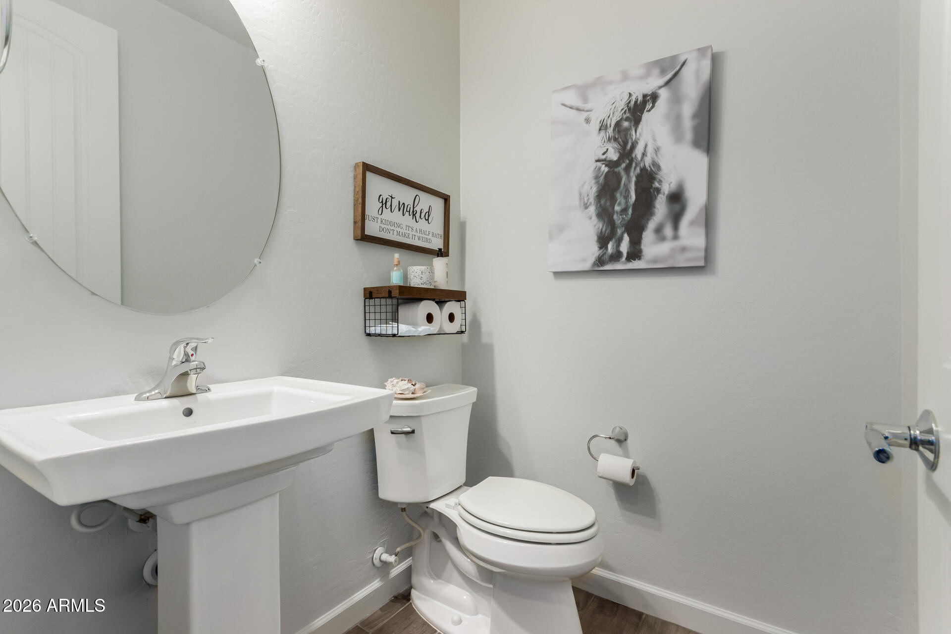 22083 East Camacho Road Queen Creek, AZ 85142 - Photo 30 of 42 a bathroom with a toilet sink and mirror