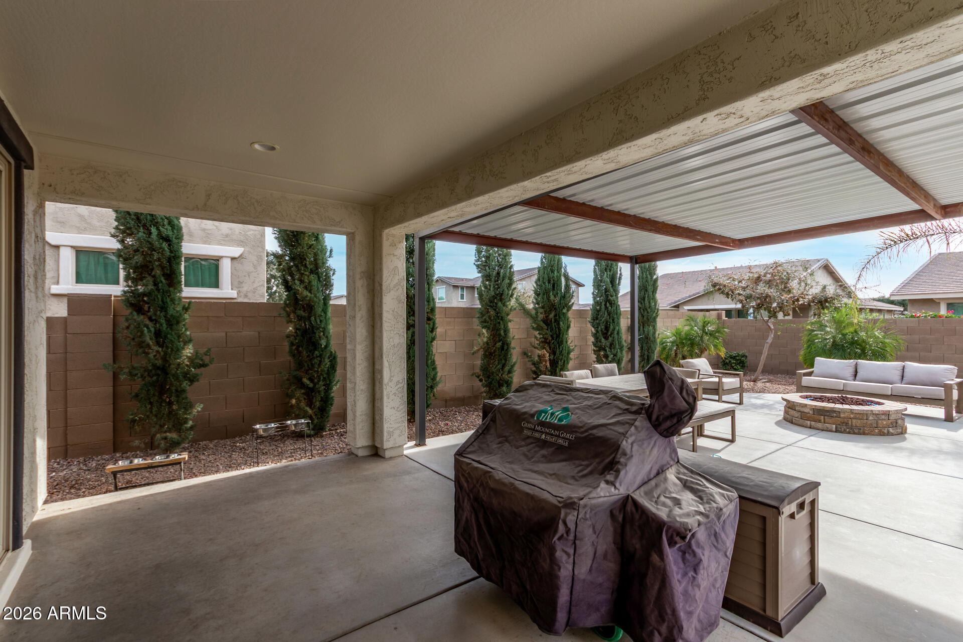 22083 East Camacho Road Queen Creek, AZ 85142 - Photo 34 of 42 a living room with furniture and a patio