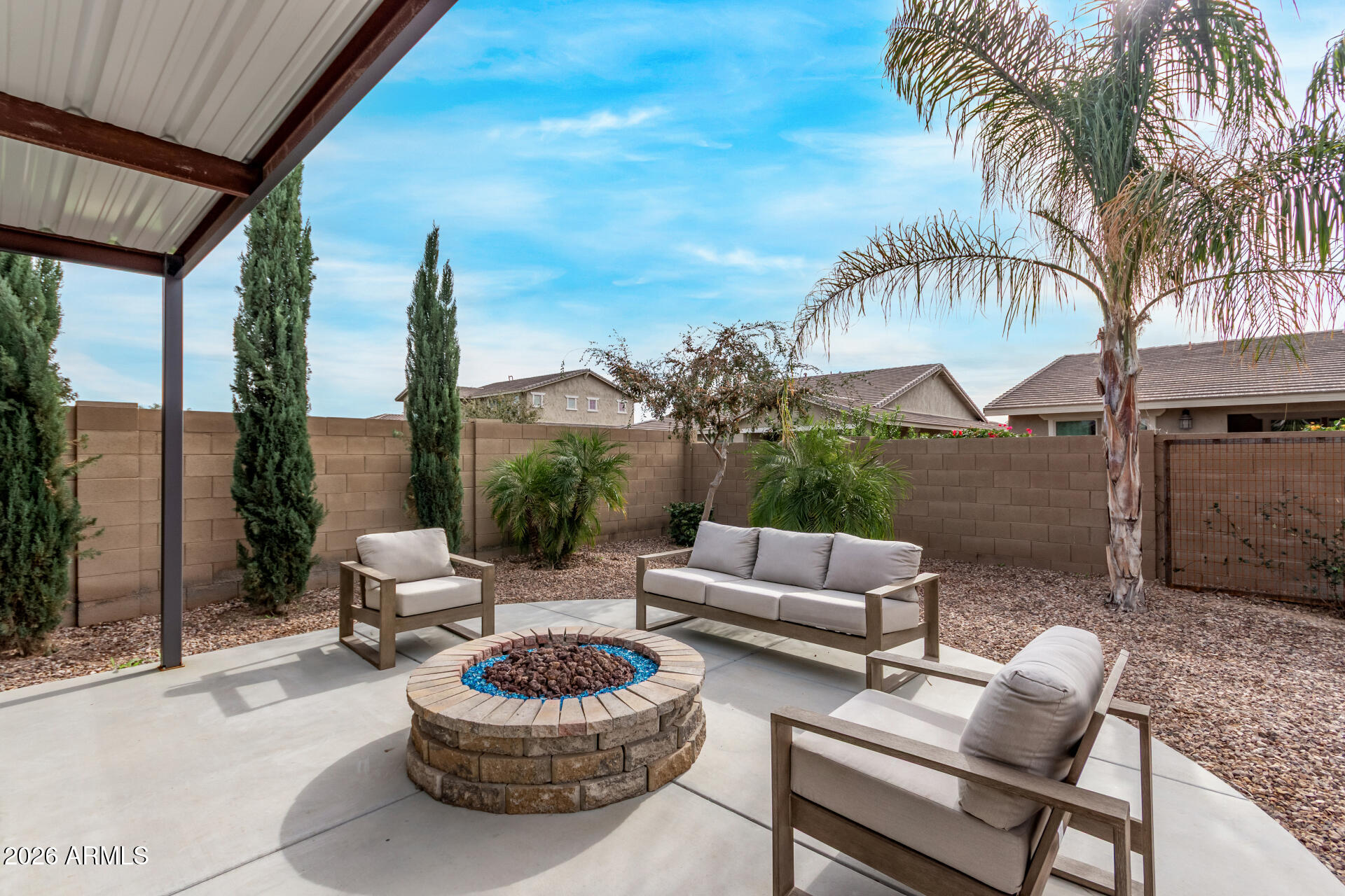 22083 East Camacho Road Queen Creek, AZ 85142 - Photo 36 of 42 a view of a patio with couches and a fire pit