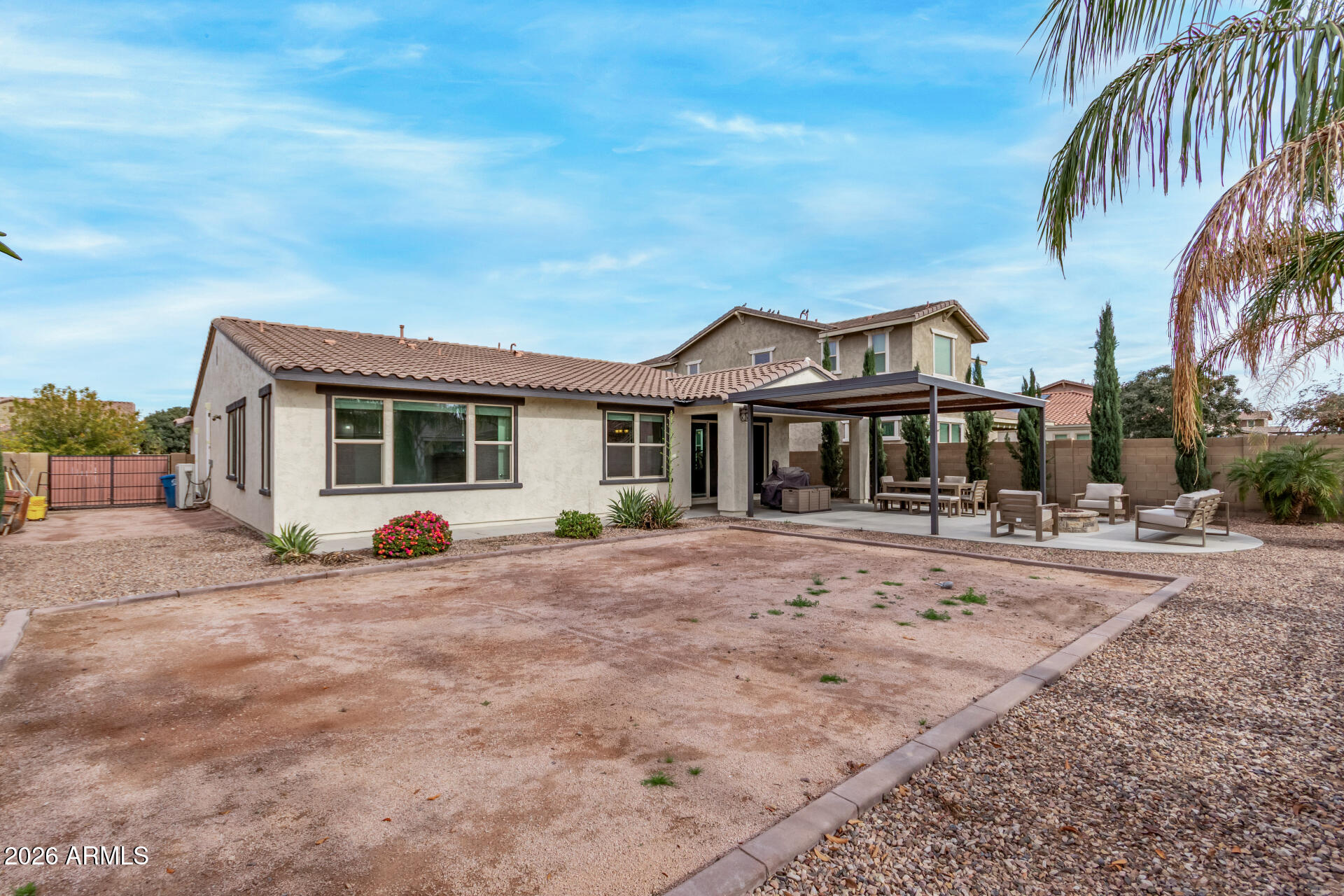 22083 East Camacho Road Queen Creek, AZ 85142 - Photo 39 of 42 a front view of a house with a yard
