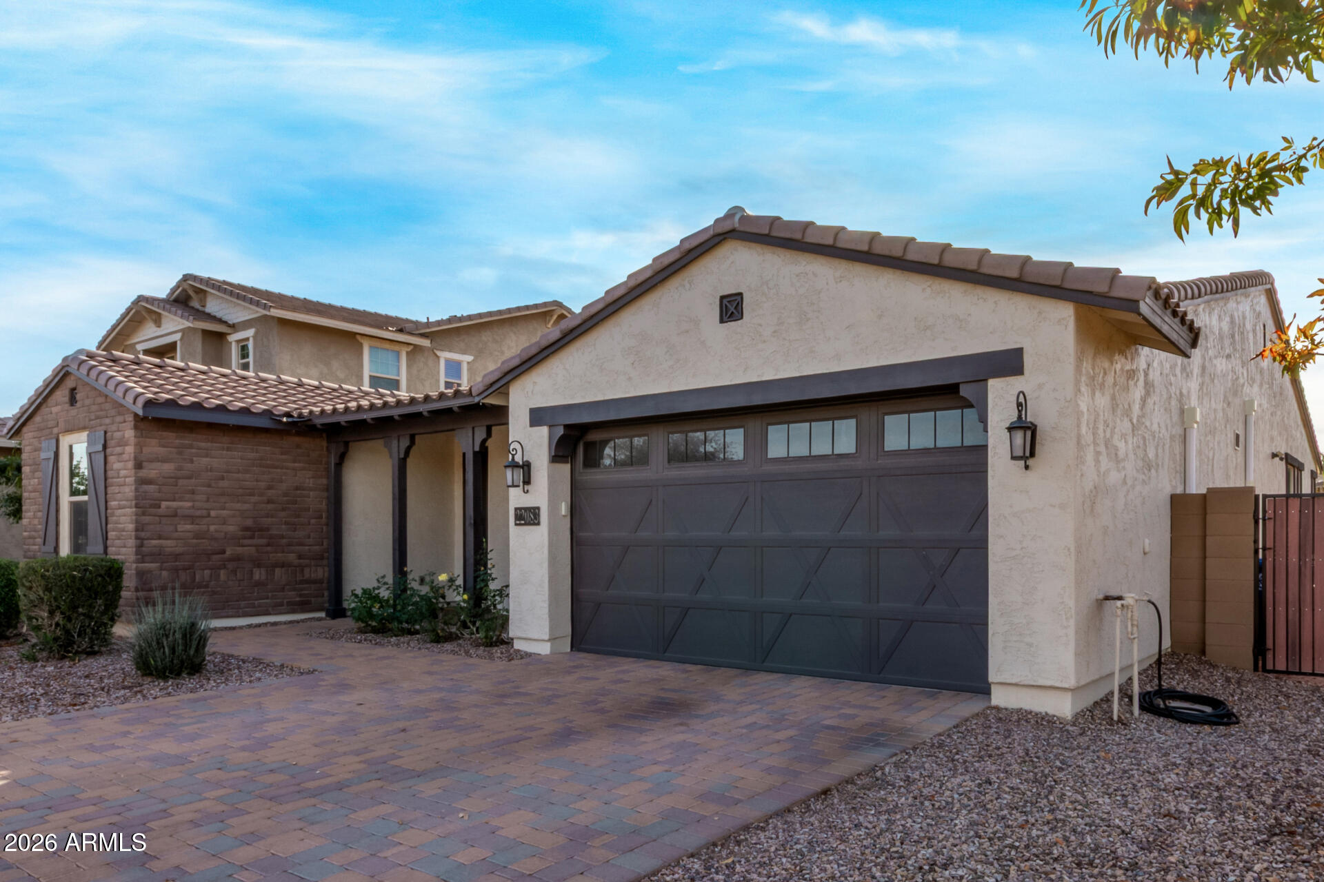 22083 East Camacho Road Queen Creek, AZ 85142 - Photo 4 of 42 a front view of a house with a yard