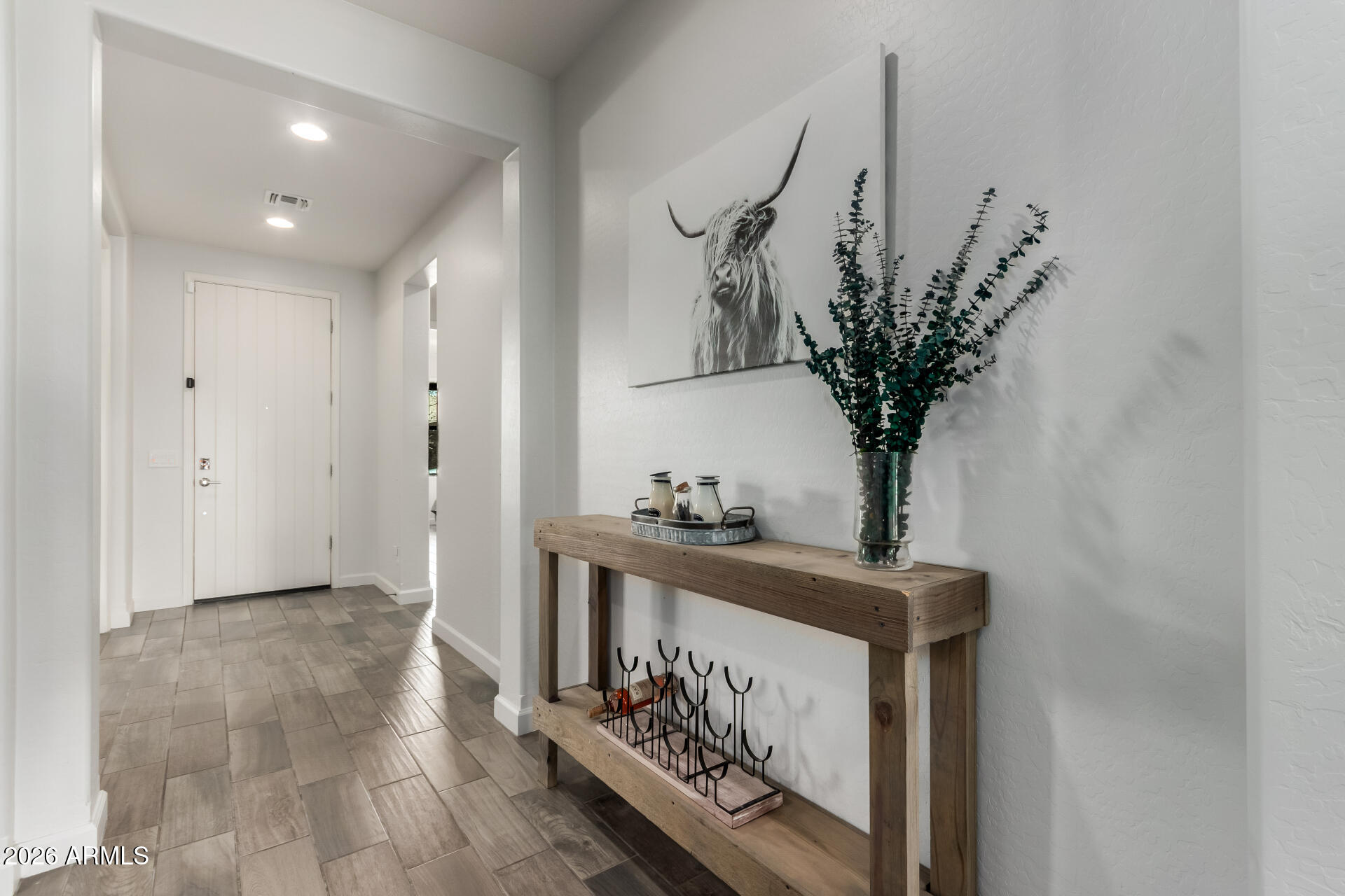 22083 East Camacho Road Queen Creek, AZ 85142 - Photo 8 of 42 a view of a hallway with a potted plant