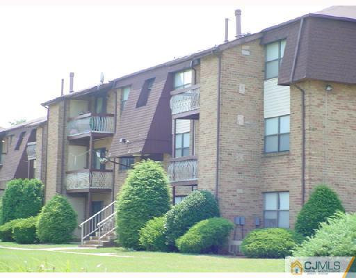 1907 Raspberry Court Edison, NJ 08817 - Photo 1 of 1 a brick building with a large windows