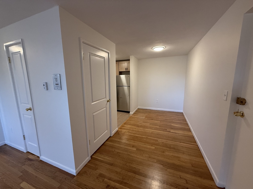 154 Main Street, Unit 32 Everett, MA 02149 - Photo 3 of 10 a view of hallway with wooden floor