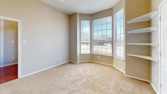 a view of an empty room and a room