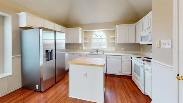 a view of kitchen and wooden floor