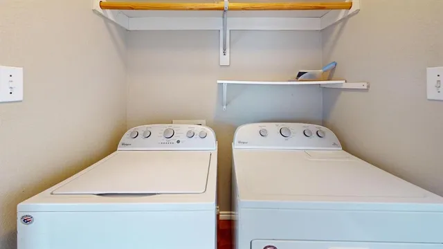 a kitchen with wooden floors and white appliances
