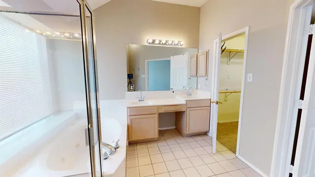 a view of a room with wooden floor and windows