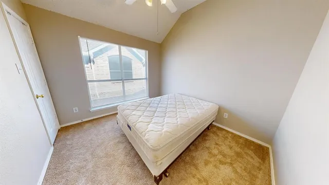 an aerial view of a residential apartment building with a yard