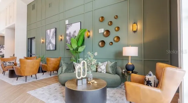 a living room with furniture and a potted plant