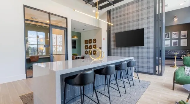 a dining room with a table and chairs