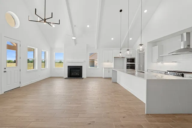 a view of kitchen with furniture and a fireplace