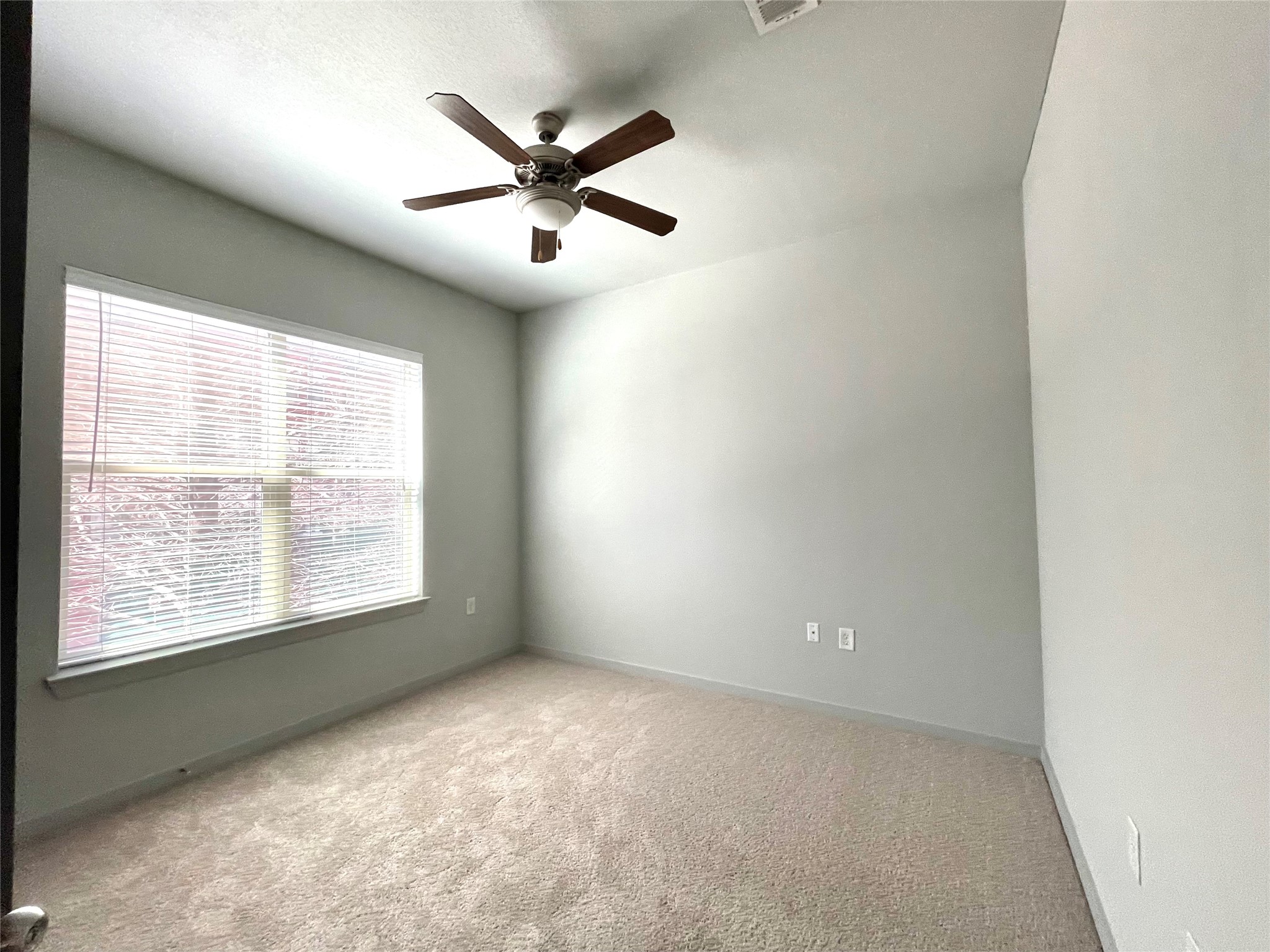 2525 McCue Road, Unit 125 Houston, TX 77056 - Photo 35 of 35 a view of a big room with windows and chandelier fan