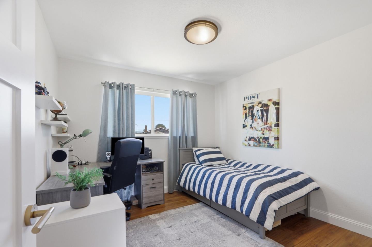 5888 Lean Way San Jose, CA 95123 - Photo 36 of 54 a bedroom with a bed and a chandelier