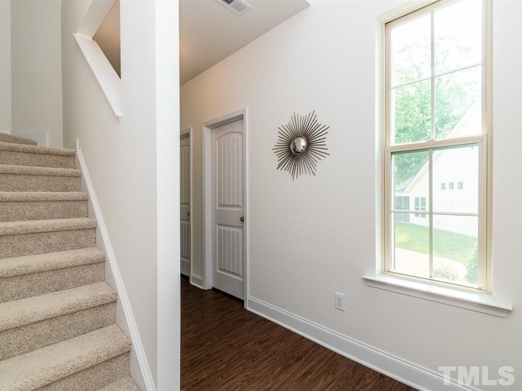 Photos are of a Model Home and may not completely represent this listing. (This home will have wrought iron railing instead of the sheet rock wall seen here)