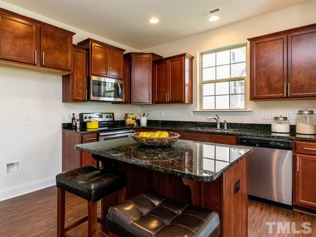 767 Heartpine Drive, Unit 97 Mebane, NC 27302 - Photo 6 of 22 Photos are of a Model Home and may not completely represent this listing. (The cabinet colors are the ones that will be in this home. The granite will be Caledonia not UbaTuba shown in photo)