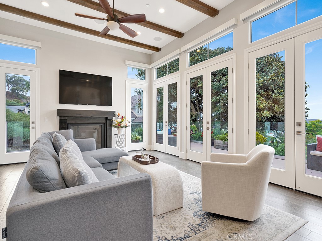 75 Marbella San Clemente, CA 92673 - Photo 11 of 54 a living room with furniture a flat screen tv and a fireplace