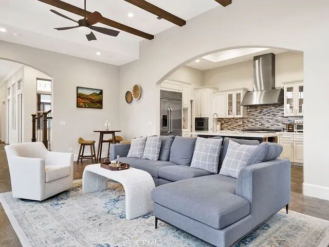 a kitchen with granite countertop white cabinets and stainless steel appliances