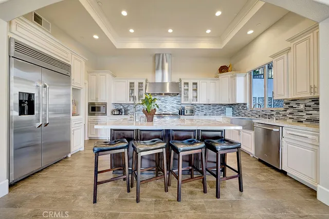 a kitchen with stainless steel appliances granite countertop a stove and a sink