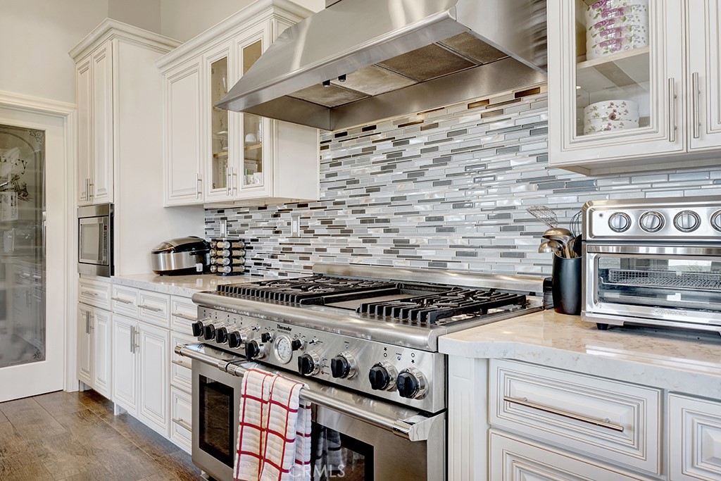 75 Marbella San Clemente, CA 92673 - Photo 14 of 54 a kitchen with stainless steel appliances granite countertop a stove and a sink