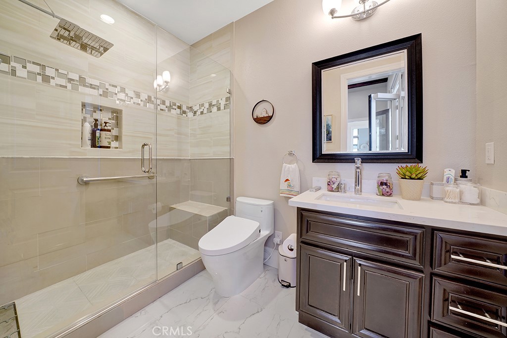 75 Marbella San Clemente, CA 92673 - Photo 22 of 54 a bathroom with a sink a toilet and shower