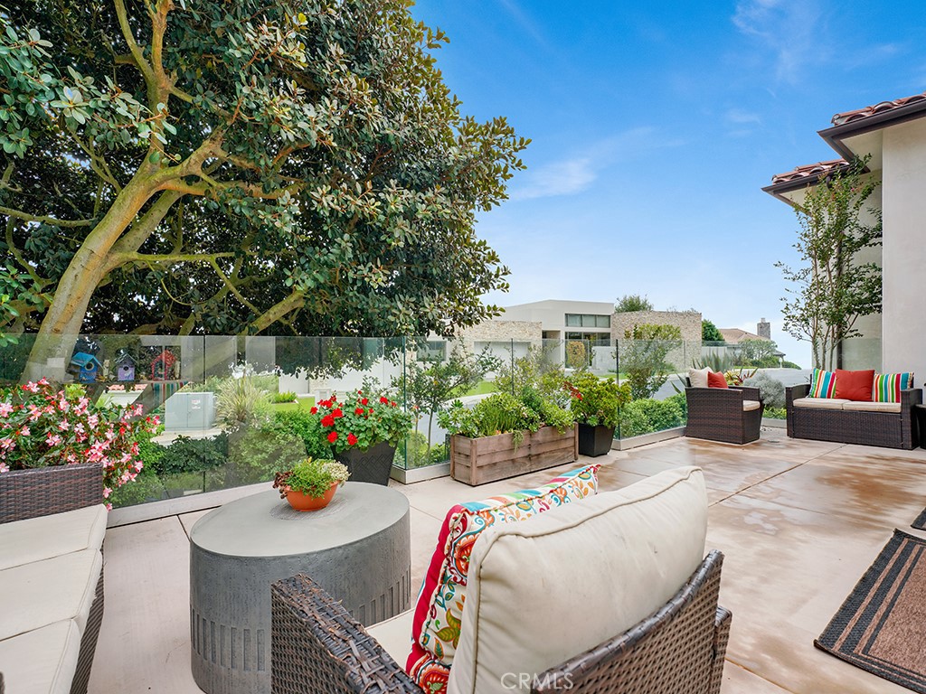 75 Marbella San Clemente, CA 92673 - Photo 25 of 54 a view of a patio with couches table and chairs and potted plants