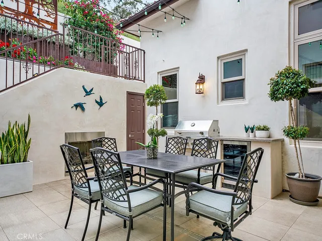 a kitchen with a stove and a potted plant